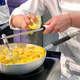 Contestant Zora Klipp of Germany prepares her second dish, penne with butternut squash sauce.